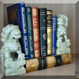 B03. Leather bound books and food dog bookends.  